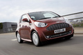 Aston Martin Cygnet marron 3/4 avant droit travelling penché 3