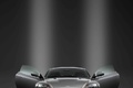 Aston Martin DB9 anthracite face avant portes ouvertes debout