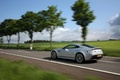 Aston Martin V12 Vantage gris 3/4 arrière gauche travelling