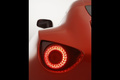 Aston Martin V12 Vantage Zagato orange feux arrières debout 2