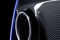 Aston Martin V8 Vantage S bleu échappement debout