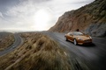 Aston Martin Virage orange 3/4 avant droit travelling