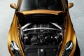 Aston Martin Virage orange face avant vue de haut capot ouvert debout