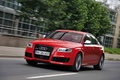 Audi RS6 rouge 3/4 avant gauche travelling penché 2