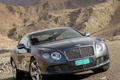 Bentley Continental GT anthracite 3/4 avant droit penché debout