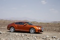 Bentley Continental GT orange 3/4 avant droit penché