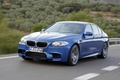 BMW M5 2011 bleu 3/4 avant gauche travelling penché 8