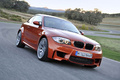 BMW Série 1 M - orange - 3/4 avant droit