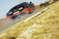 Bugatti Veyron Super Sport noir/orange 3/4 arrière droit filé penché