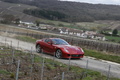 Ferrari 599 GTB Fiorano rouge roulant dans un vignoble de champasgne 1.