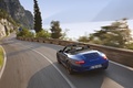 Porsche 997 Carrera GTS Cabriolet bleu 3/4 arrirèe gauche travelling penché vue de haut 3