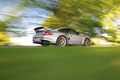 Porsche 997 GT2 RS gris 3/4 arrière droit travelling