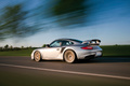 Porsche 997 GT2 RS gris 3/4 arrière gauche travelling 2