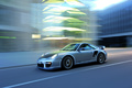 Porsche 997 GT2 RS gris 3/4 avant gauche travelling penché