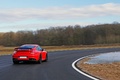 Porsche 997 GT2 RS rouge 3/4 arrière droit travelling