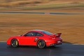 Porsche 997 GT2 RS rouge 3/4 arrière gauche filé