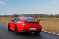 Porsche 997 GT2 RS rouge 3/4 arrière gauche travelling 2