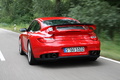Porsche 997 GT2 RS rouge 3/4 arrière gauche travelling