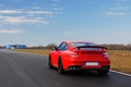 Porsche 997 GT2 RS rouge 3/4 arrière gauche travelling