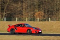 Porsche 997 GT2 RS rouge 3/4 avant droit filé