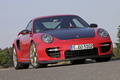 Porsche 997 GT2 RS rouge 3/4 avant droit penché