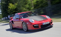 Porsche 997 GT2 RS rouge 3/4 avant droit travelling penché