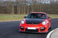 Porsche 997 GT2 RS rouge 3/4 avant gauche travelling 2