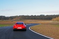 Porsche 997 GT2 RS rouge face arrière travelling