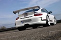 Porsche 997 GT3 RS 4.0 blanc 3/4 arrière droit penché