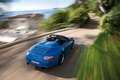 Porsche 997 Speedster bleu 3/4 arrière droit vue de haut travelling