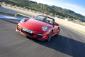 Porsche 997 Turbo Cabriolet MkII rouge 3/4 avant gauche travelling penché