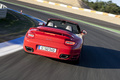 Porsche 997 Turbo Cabriolet MkII rouge face arrière travelling penché