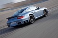 Porsche 997 Turbo S bleu 3/4 arrière droit travelling penché 2