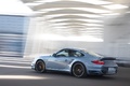 Porsche 997 Turbo S bleu 3/4 arrière gauche travelling penché
