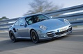Porsche 997 Turbo S bleu 3/4 avant droit travelling penché 2