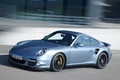 Porsche 997 Turbo S bleu 3/4 avant gauche travelling penché 2