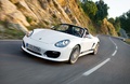 Porsche Boxster Spyder blanc 3/4 avant gauche travelling penché