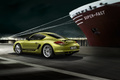 Porsche Cayman R - vert - 3/4 arrière gauche, filé