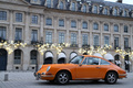 Traversée de Paris 2012 - Porsche 911 Carrera orange 3/4 avant gauche