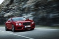 Bentley Continental GT V8 rouge 3/4 avant droit travelling penché