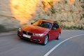 BMW 335i - rouge - 3/4 avant gauche, dynamique