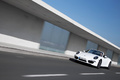Porsche 991 Carrera 4S Cabriolet blanc 3/4 avant gauche travelling penché 3
